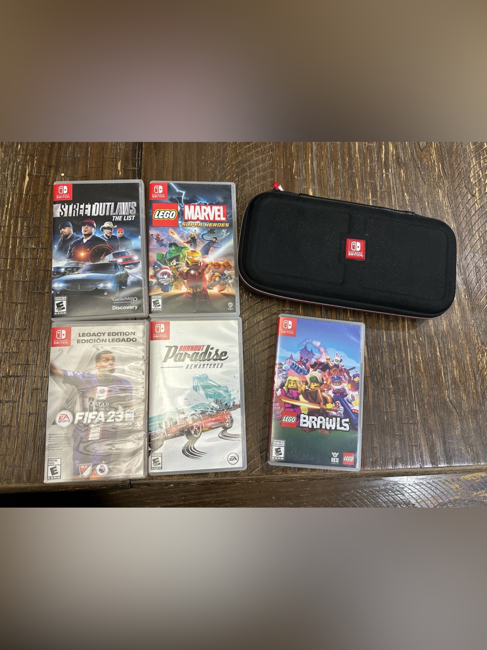 Nintendo Black Travel Case with Red Accent and Five Switch Game Cases